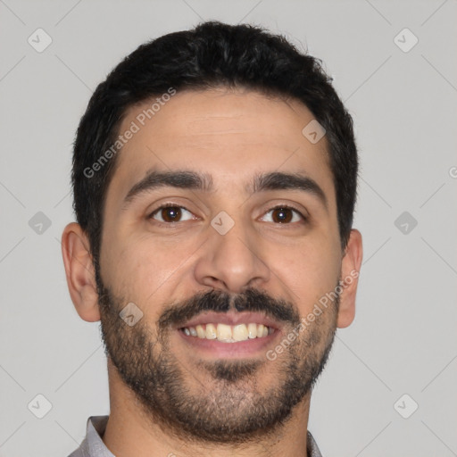 Joyful latino young-adult male with short  black hair and brown eyes