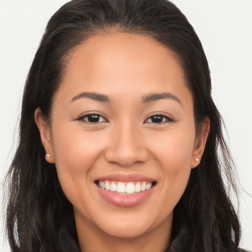 Joyful white young-adult female with long  brown hair and brown eyes