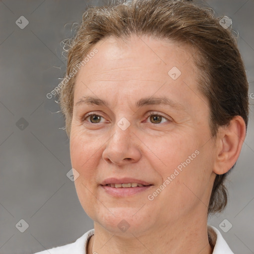 Joyful white adult female with short  brown hair and brown eyes