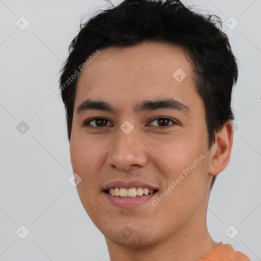 Joyful white young-adult male with short  black hair and brown eyes