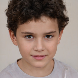 Joyful white child male with short  brown hair and brown eyes