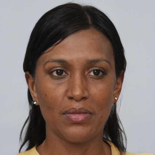 Neutral black adult female with medium  brown hair and brown eyes