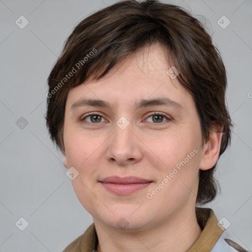 Joyful white young-adult female with medium  brown hair and grey eyes