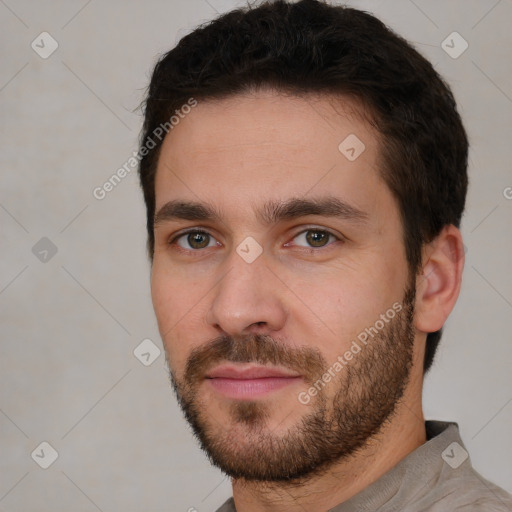 Joyful white young-adult male with short  brown hair and brown eyes