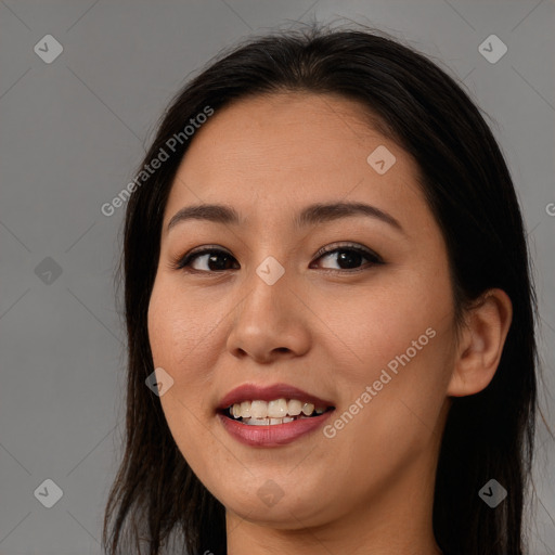 Joyful asian young-adult female with long  brown hair and brown eyes