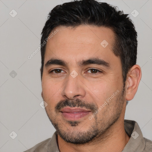 Joyful white young-adult male with short  black hair and brown eyes