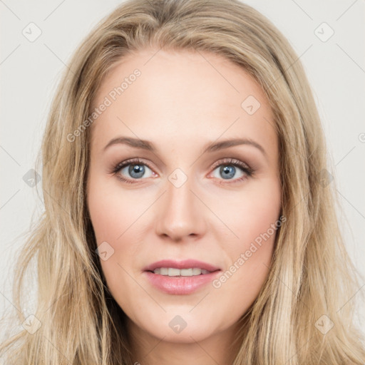 Joyful white young-adult female with long  brown hair and blue eyes