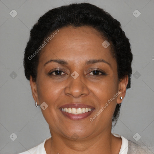 Joyful black adult female with short  brown hair and brown eyes