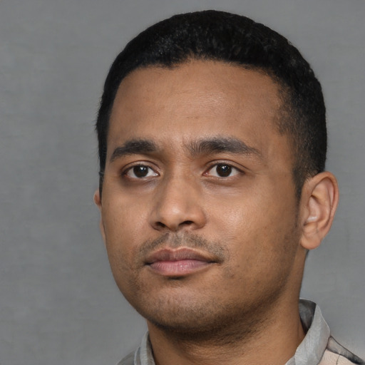 Neutral black young-adult male with short  black hair and brown eyes