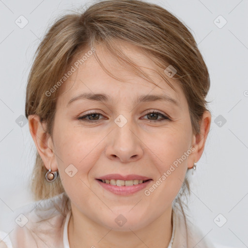 Joyful white adult female with medium  brown hair and grey eyes