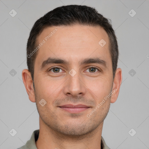 Joyful white young-adult male with short  brown hair and brown eyes