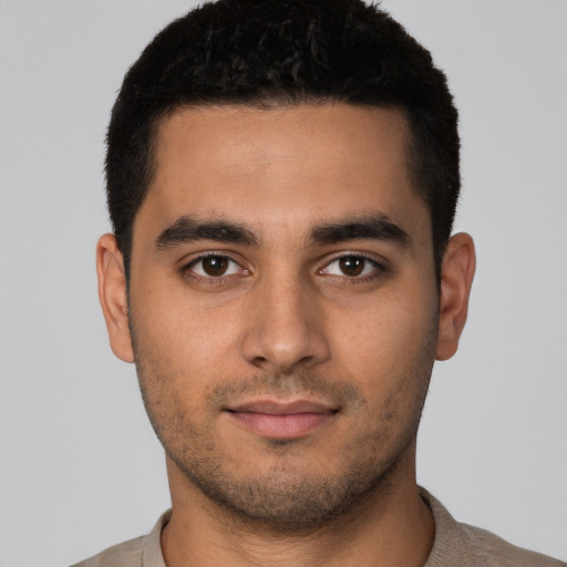 Neutral latino young-adult male with short  black hair and brown eyes
