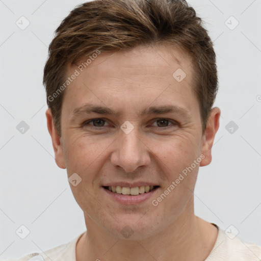 Joyful white adult male with short  brown hair and grey eyes