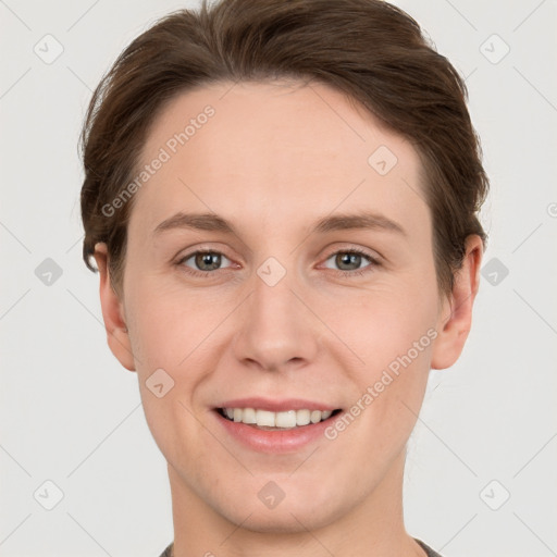 Joyful white young-adult female with short  brown hair and grey eyes