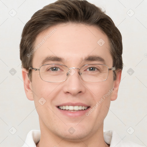 Joyful white adult male with short  brown hair and grey eyes