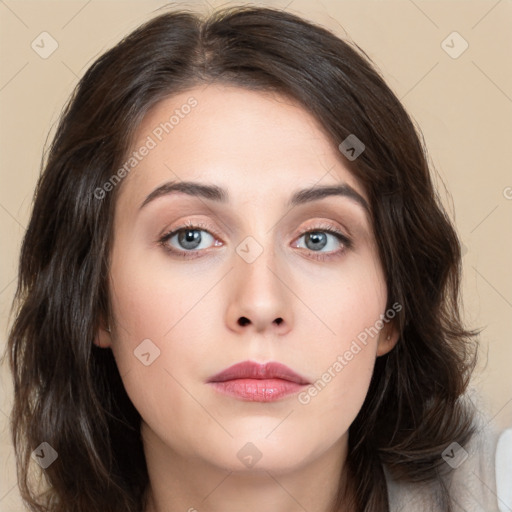 Neutral white young-adult female with long  brown hair and brown eyes