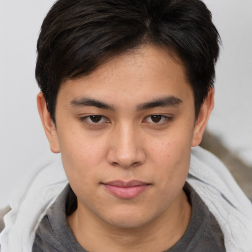 Neutral asian young-adult male with medium  brown hair and brown eyes