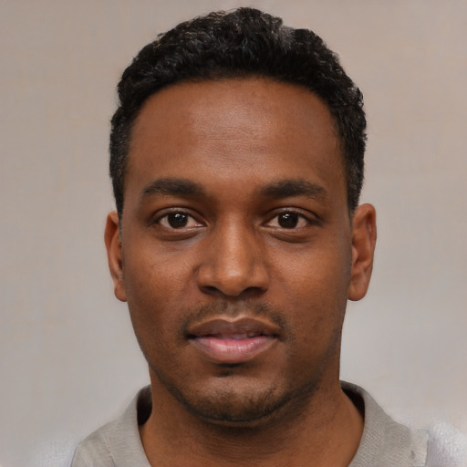 Neutral black young-adult male with short  black hair and brown eyes