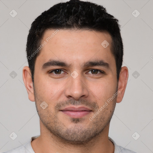 Joyful white young-adult male with short  black hair and brown eyes