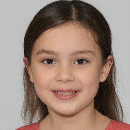 Joyful white child female with medium  brown hair and brown eyes