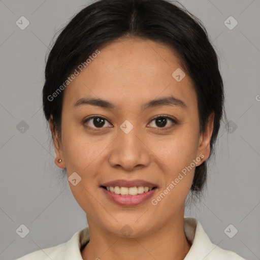 Joyful asian young-adult female with medium  black hair and brown eyes