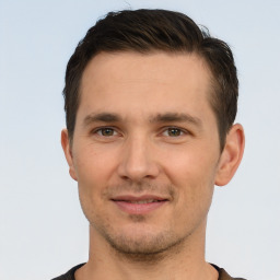 Joyful white young-adult male with short  brown hair and brown eyes