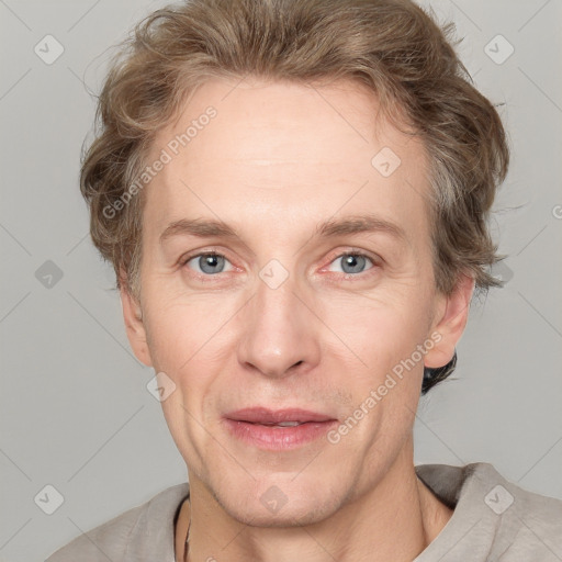 Joyful white adult male with short  brown hair and grey eyes