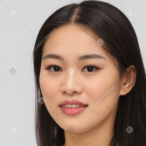 Joyful asian young-adult female with long  brown hair and brown eyes