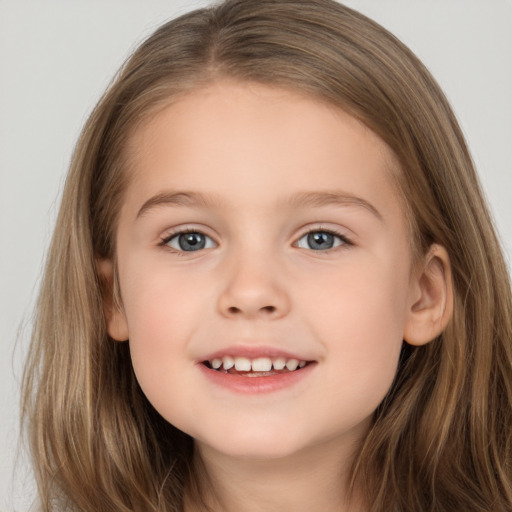 Joyful white child female with long  brown hair and brown eyes