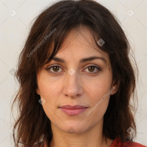 Joyful white adult female with long  brown hair and brown eyes