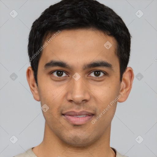 Joyful latino young-adult male with short  black hair and brown eyes