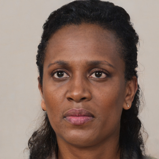 Neutral black adult female with long  black hair and brown eyes