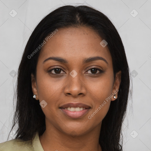 Joyful black young-adult female with long  brown hair and brown eyes