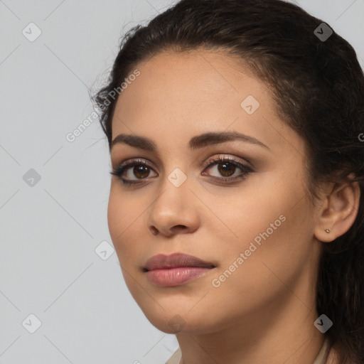 Joyful latino young-adult female with long  brown hair and brown eyes