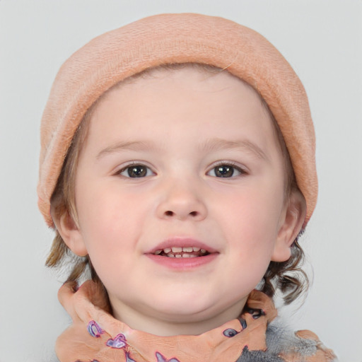 Joyful white child female with short  brown hair and blue eyes