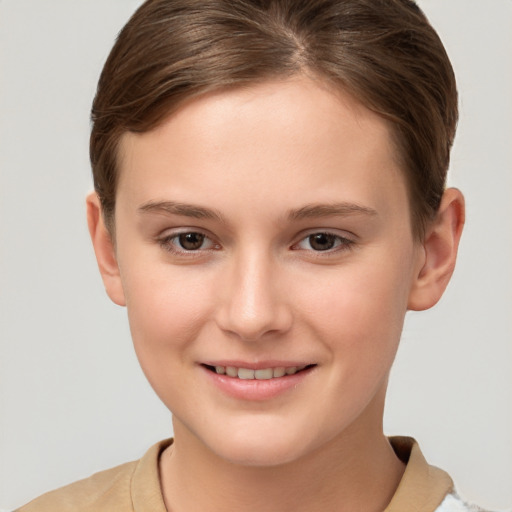 Joyful white child female with short  brown hair and brown eyes