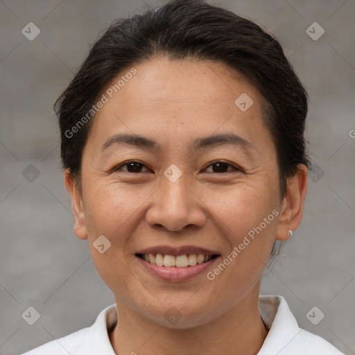 Joyful white adult female with short  brown hair and brown eyes