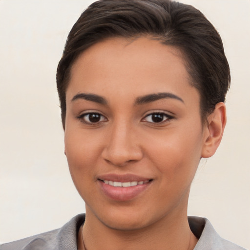 Joyful white young-adult female with short  brown hair and brown eyes