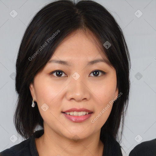 Joyful asian young-adult female with medium  brown hair and brown eyes