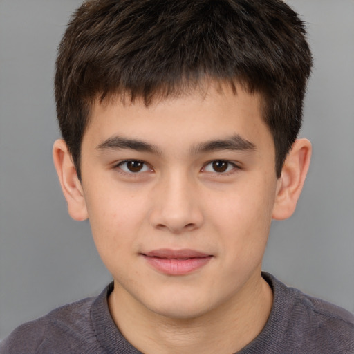 Joyful white child male with short  brown hair and brown eyes