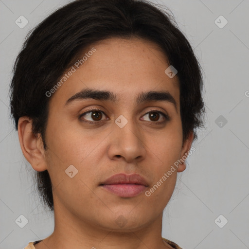 Joyful latino young-adult male with short  brown hair and brown eyes