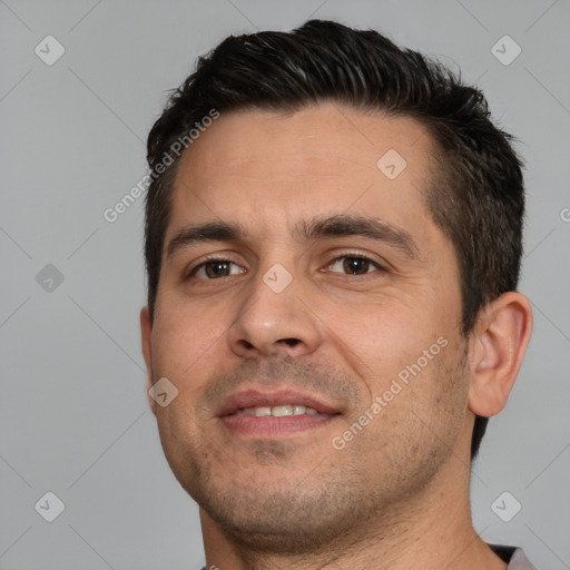 Joyful white young-adult male with short  brown hair and brown eyes