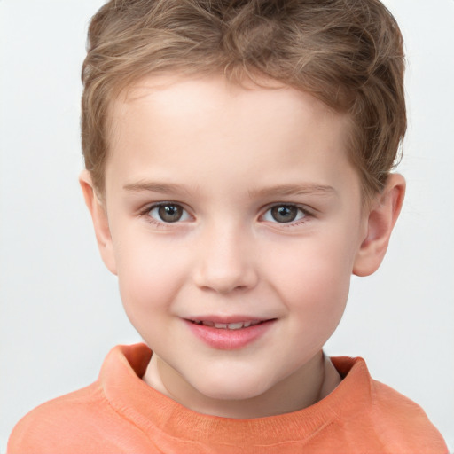 Joyful white child male with short  brown hair and brown eyes