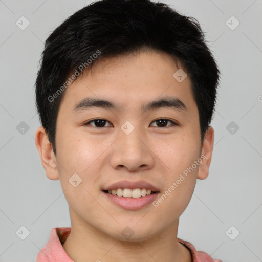 Joyful asian young-adult male with short  brown hair and brown eyes