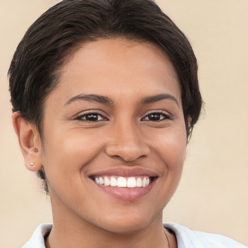 Joyful white young-adult female with short  brown hair and brown eyes