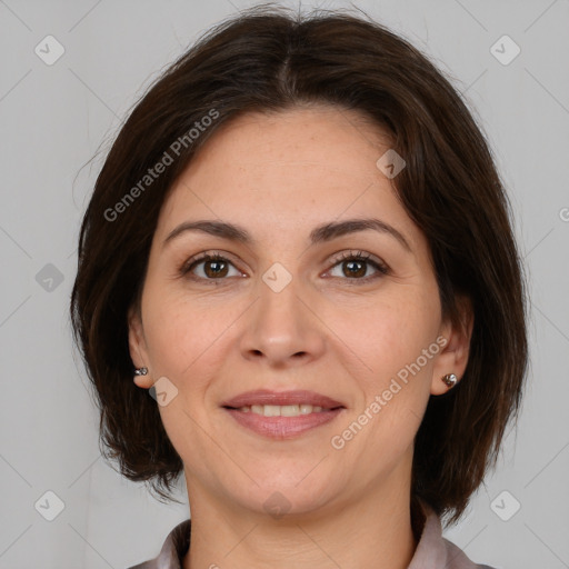 Joyful white adult female with medium  brown hair and brown eyes