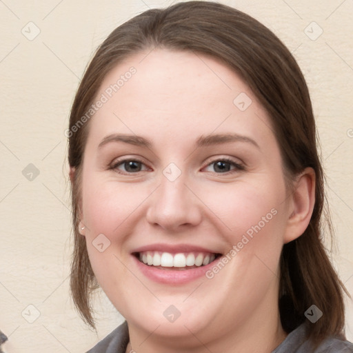 Joyful white young-adult female with medium  brown hair and blue eyes