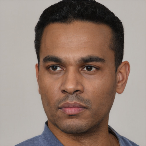 Neutral latino young-adult male with short  black hair and brown eyes