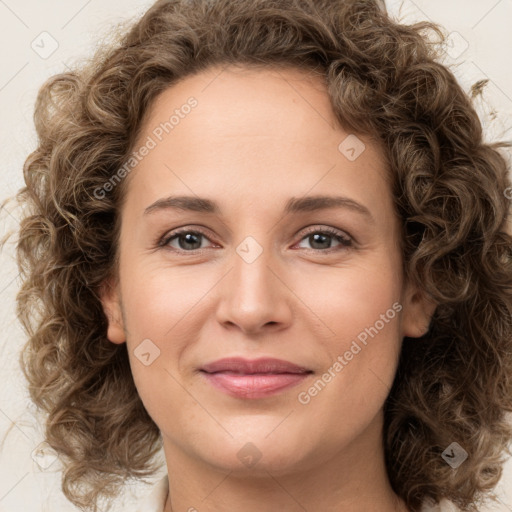 Joyful white young-adult female with medium  brown hair and green eyes