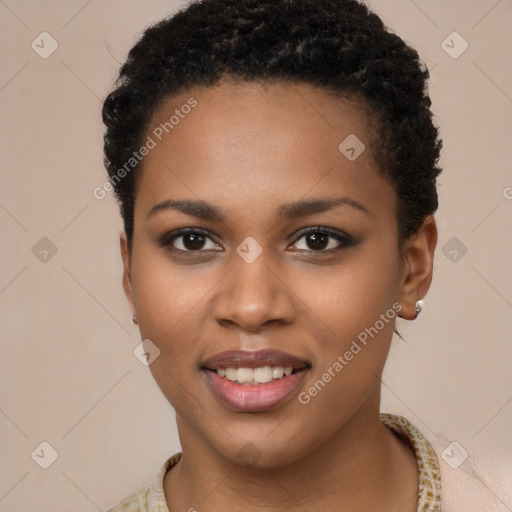 Joyful black young-adult female with short  brown hair and brown eyes